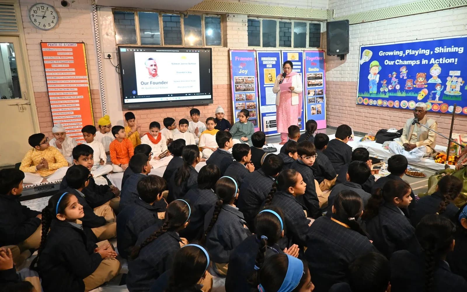 Students and teachers taking part in a values-led school assembly