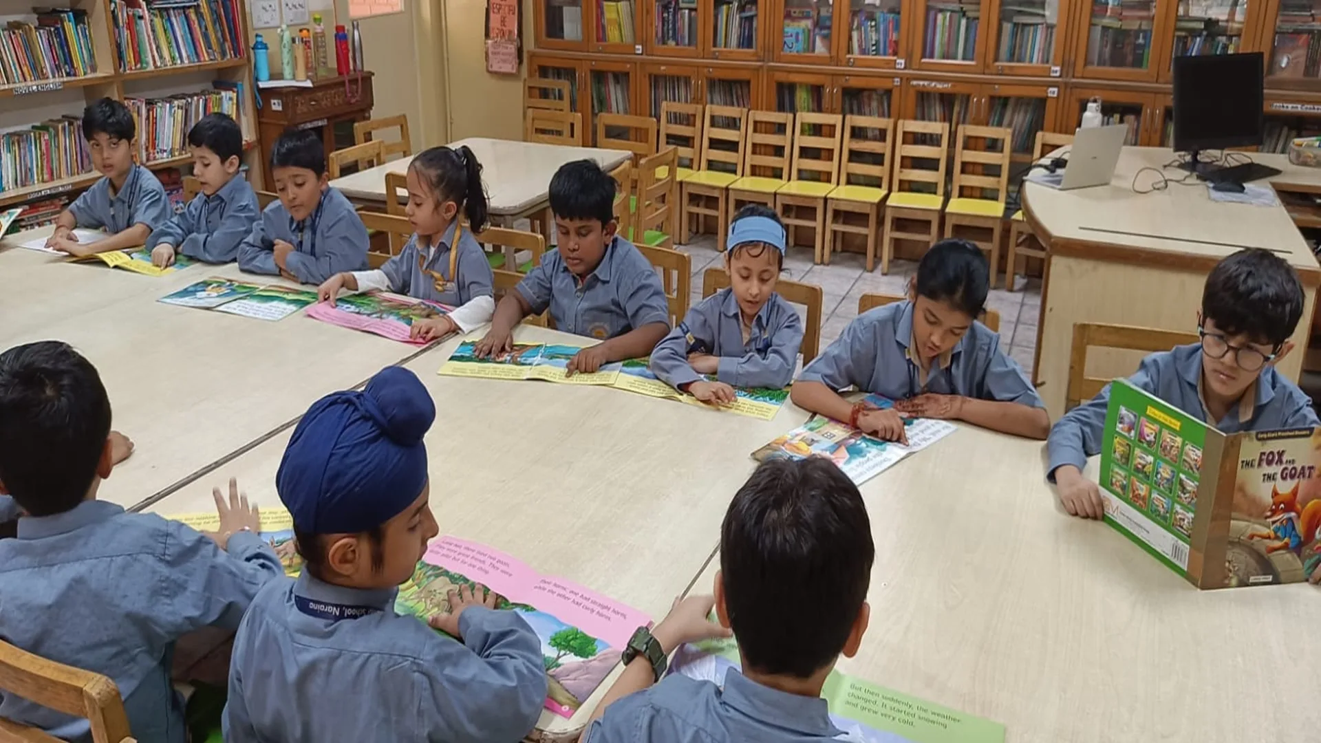 Students reading a school publication together
